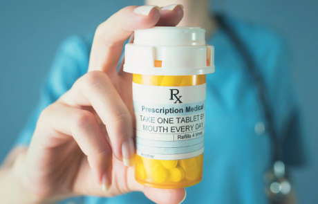 Blog Clinician Holding Prescription Drugs