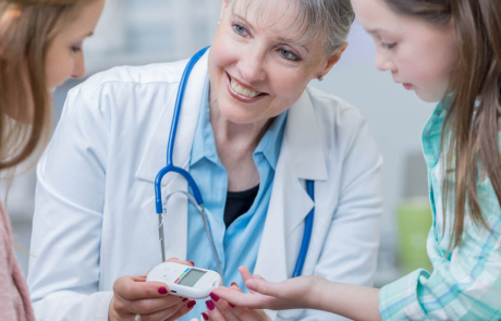 Blog Researcher Checks Patient Child T1D Blood Sugar