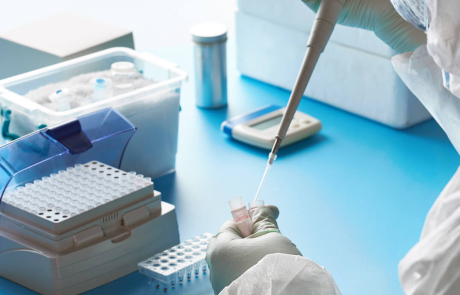Blog Researcher Holding COVID Samples