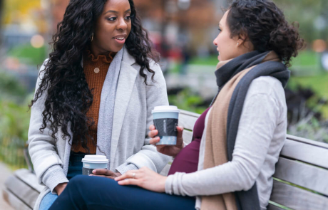 Blog Women Pregnant Talking Bench Outside