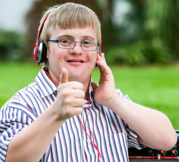 Blog Main Image - Down Syndrome (DS) Boy Headset Thumbs-up