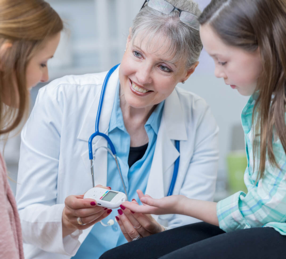 Blog Main Image - Researcher Checks Patient Child T1D Blood Sugar