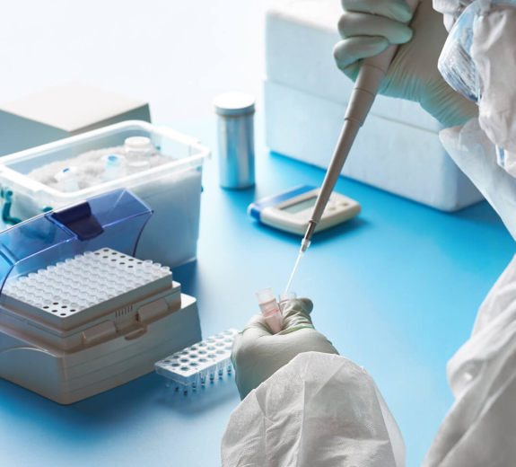 Blog Researcher Holding COVID Samples