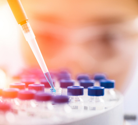 Blog Main Image - Researcher Woman Pipetting Samples Blue