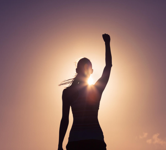 Blog Main Image - Woman Fist Raised Silhouette