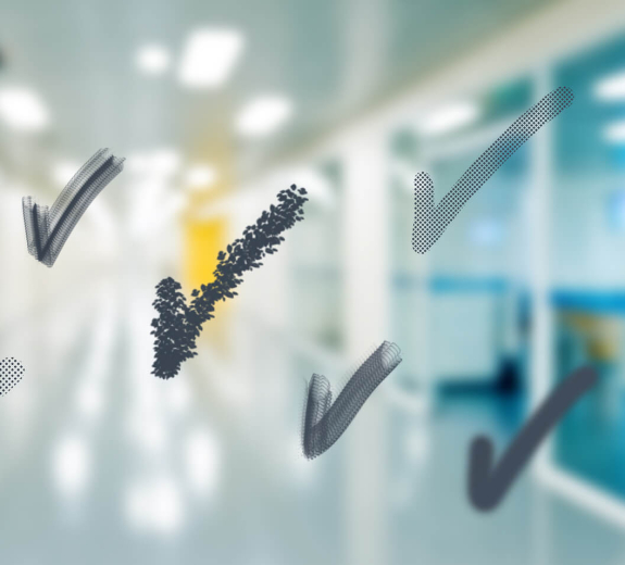 Blog Defocused Empty Corridor in Hospital with Checkmarks