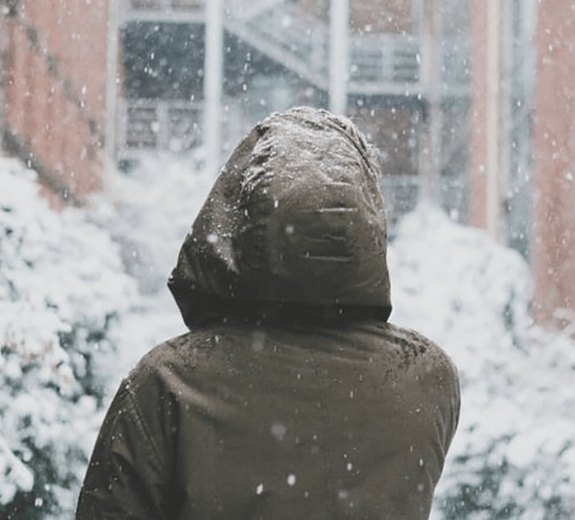 Blog Woman Facing Snowy City