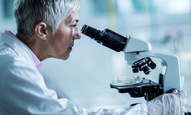 Blog Researcher Woman Looking Microscope Side View