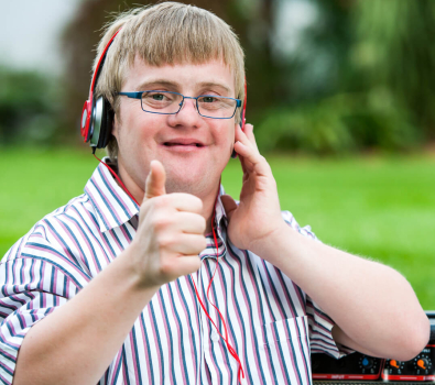 Blog Down Syndrome (DS) Boy Headset Thumbs-up