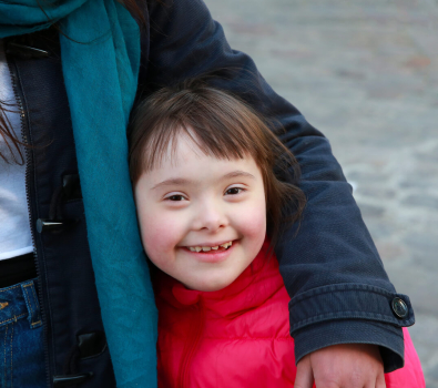 Down Syndrome (DS) Girl Under Mother Arm